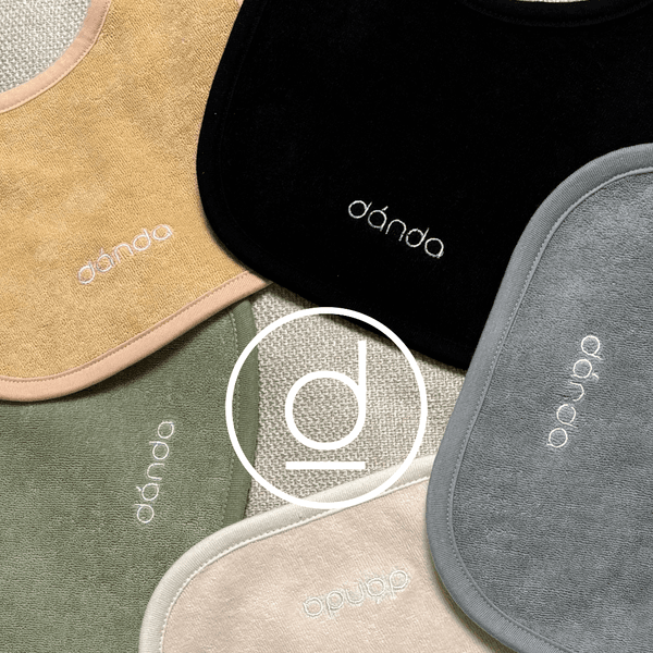 A collection of five danda fabric bibs.